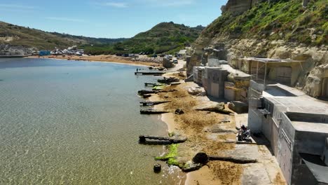 Bask-in-the-glow-of-Gnejna-Bay's-sunlit-shores-and-inviting-waters-in-this-revealing-drone-footage-of-Malta's-peaceful-coastal-life