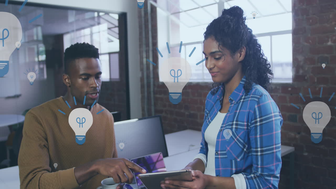Animation of light bulb icons and data processing over diverse business people