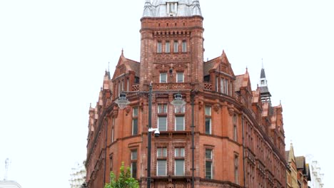 Establishing-shot-of-a-posh,-red-brick-apartment-office-building