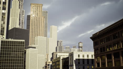 skyline view of urban architecture under dramatic clouds at dusk