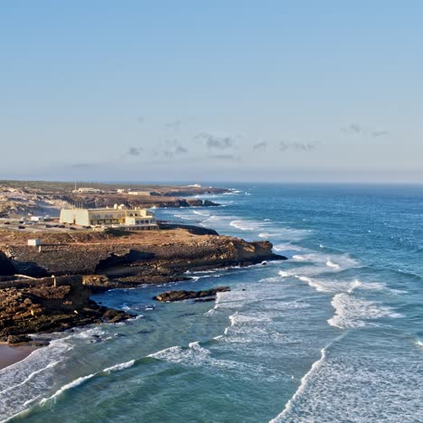 sandy beach in portugal, with cliffs and beautiful coastal scenery coastline landscape