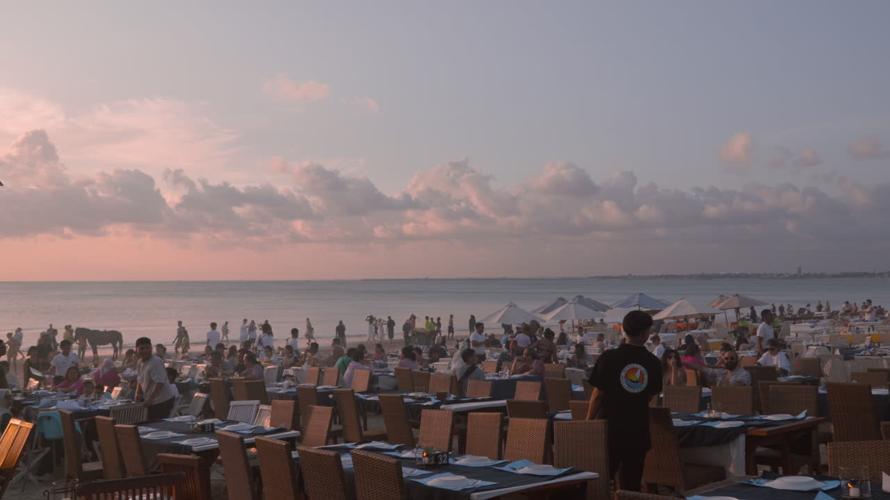 Sunset Beach Restaurant with Crowds Dining by the Ocean