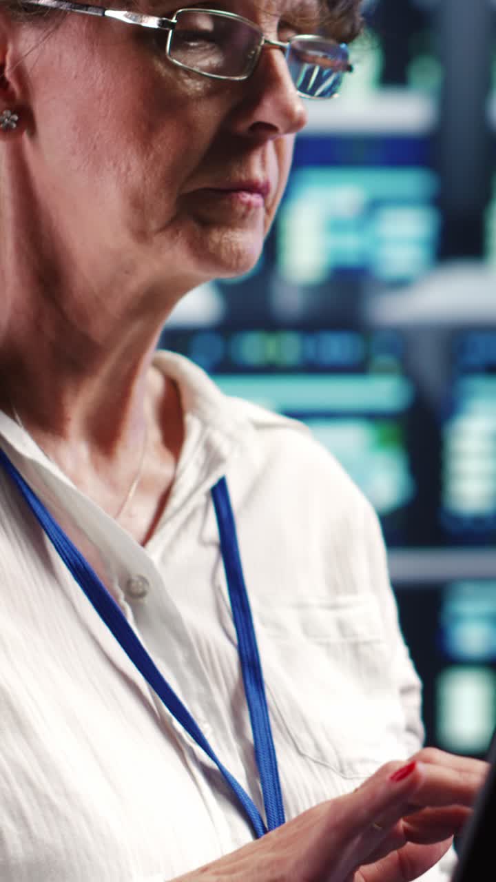 Woman in security control room