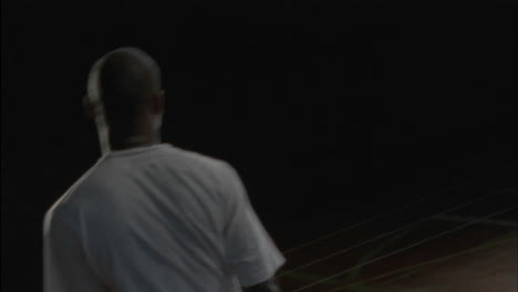three men play basketball on an indoor court 3