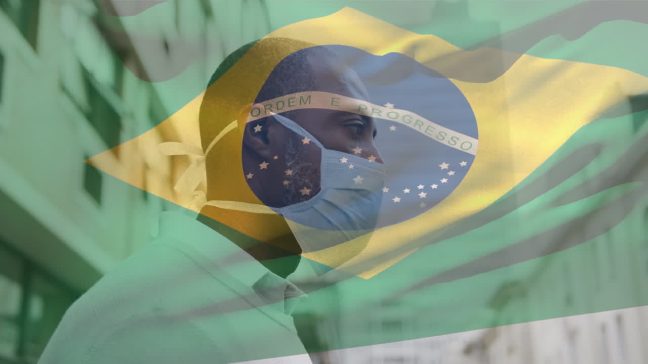 animación de la bandera de brasil ondeando sobre un hombre afroamericano con máscara facial en la calle de la ciudad