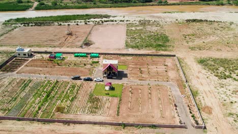 Aerial-View-Farmhouse,-Hills,-Agriculture-Fields