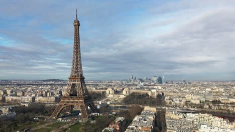 Tour-Eiffel-and-La-Defense-business-district-in-background,-Paris-in-France