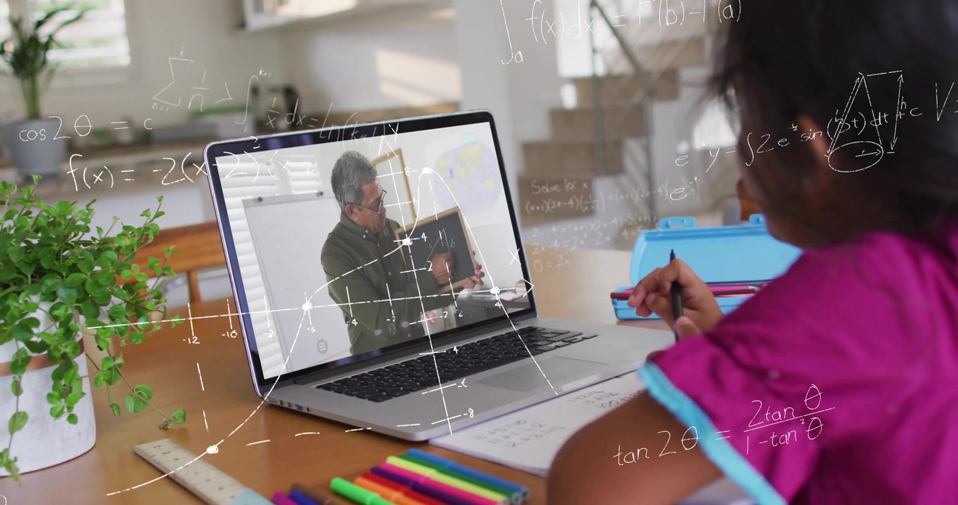 Child writing at desk on laptop, tutor turning board and adding math overlays guiding study