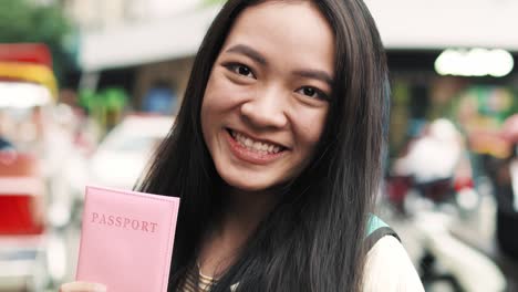 Handheld-view-of-young-Vietnamese-woman-with-passport