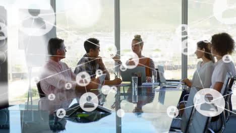 animation of network of connections with icons over diverse business people in office