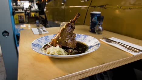 plate with steak served on the table in restaurant