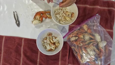 top down time lapse of a bag full of crab being cracked