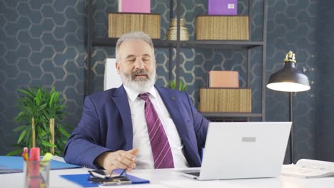 Businessman-finishing-his-work-and-relaxing.