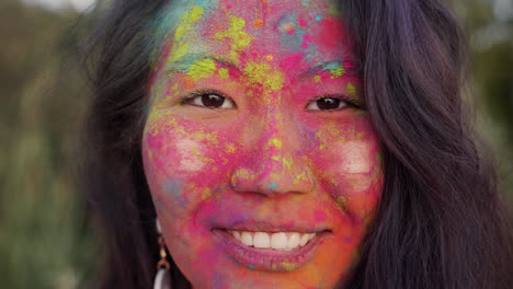 woman with colorful holi face painting