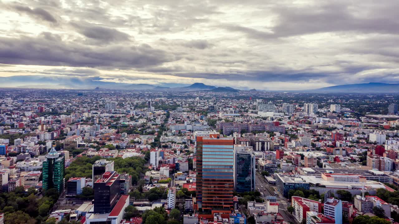Flying backward over Benito Juarez in Mexico City, Aerial Cloud Hyperlapse