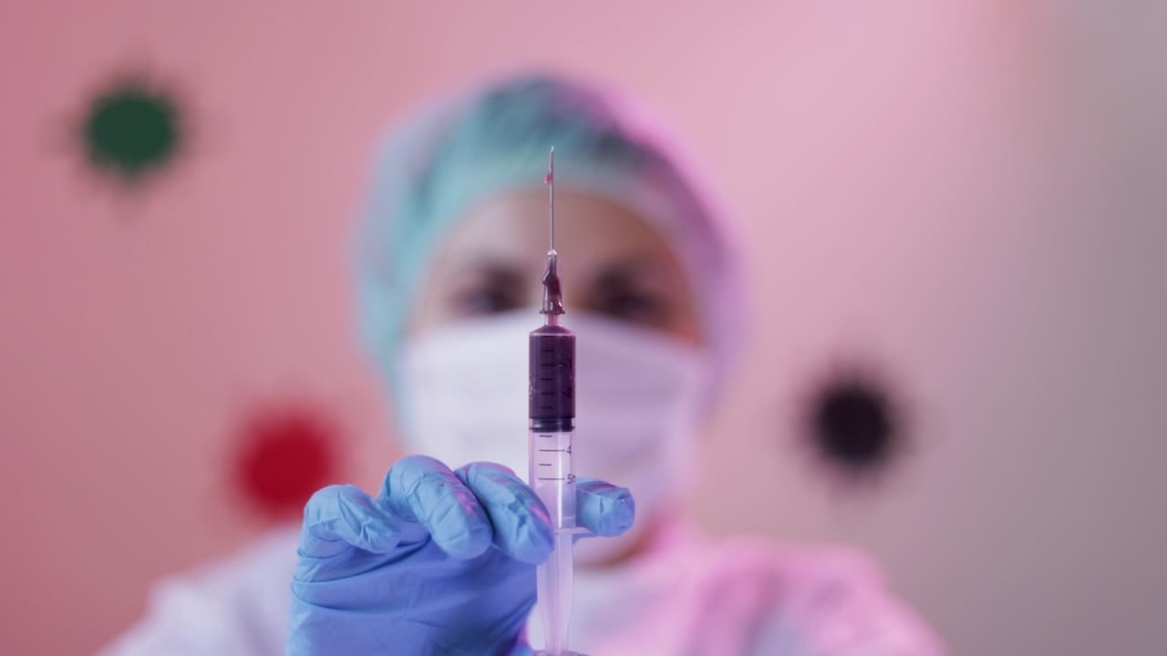 Injection needle spilling blood drops preparing for DNA test by nurse on hospital for positive patient with Coronavirus
