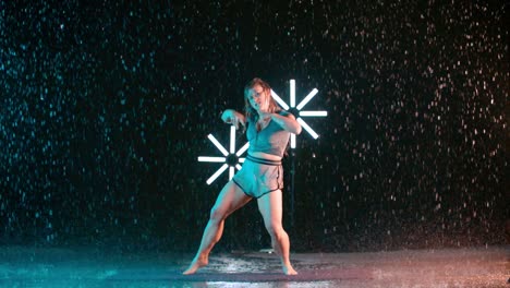 female caucasian young dancer, contemporary dance moves, indoor rain effect