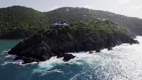 Beautiful-aerial-drone-wide-shot-blue-sky-turquoise-water-of-building-on-hill-of-St