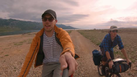 two guys cycling and filming themselves