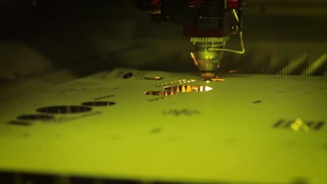 CNC-Laser-cutting-of-metal-in-slow-motion,-modern-industrial-technology.