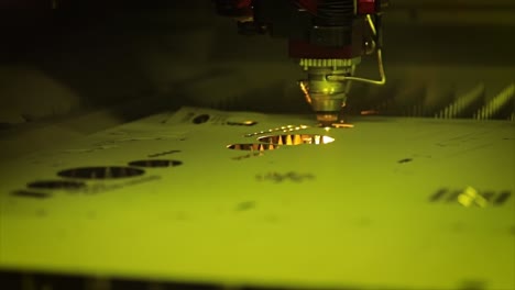 cnc laser cutting of metal in slow motion, modern industrial technology.