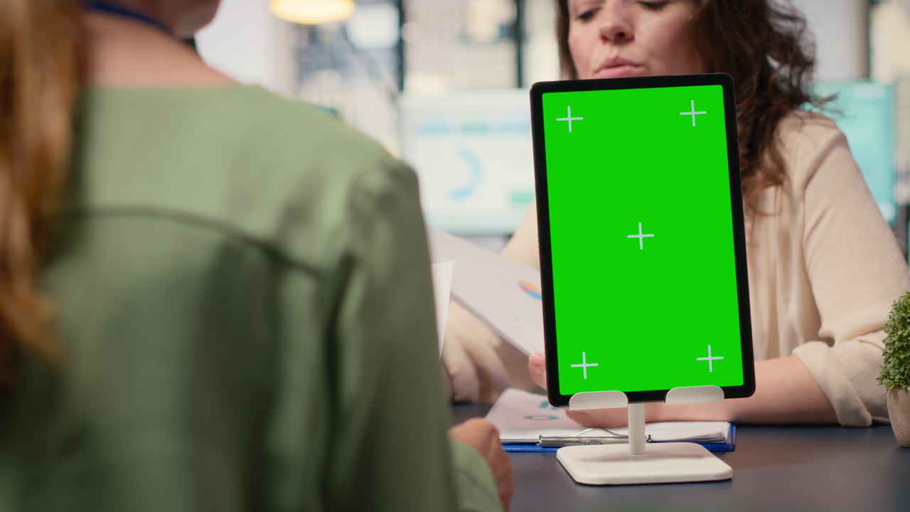 Vertical Video Business associates group using chroma key screen in modern office meeting