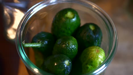 cucumbers are placed in a glass and filled up with broth