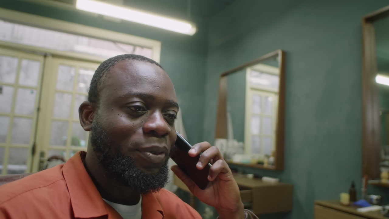 African American Barber Having Conversation Talk in Hair Salon