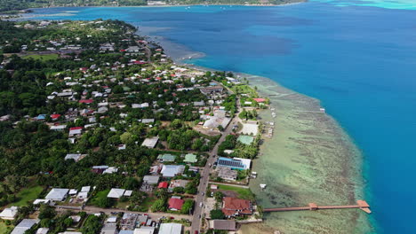 bora bora, french polynesia. drone shot of coastal village and coastline of main island