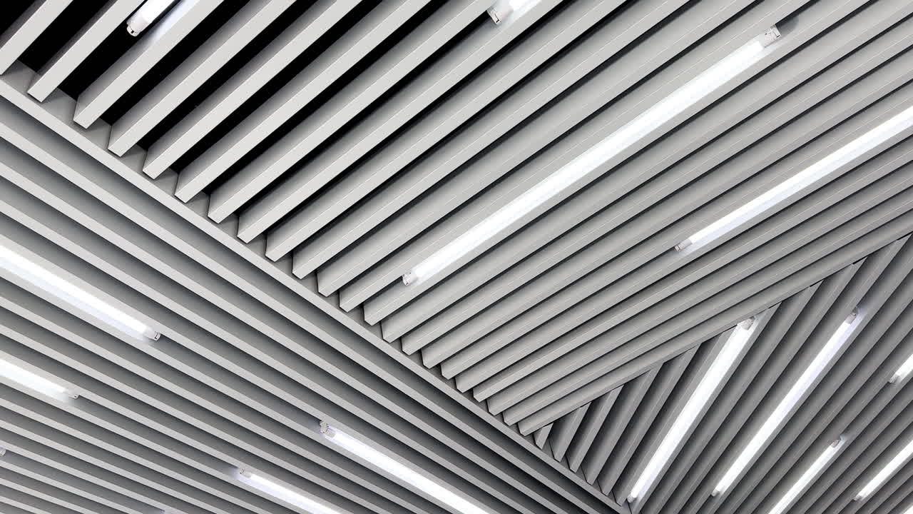 Decoration planks on the ceiling with led lamps for white day illumination. Black and white image. Low angle view.