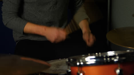 Man-playing-a-drums