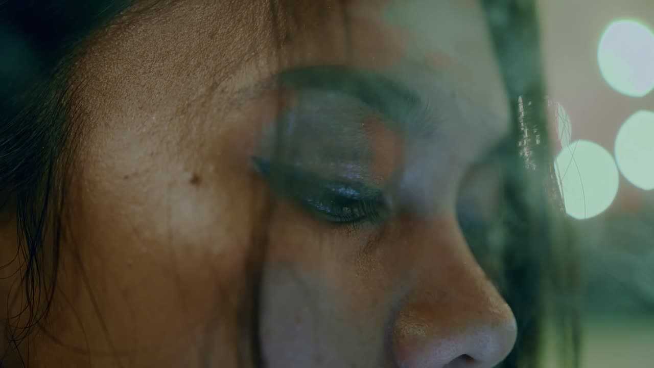 Close-up of a woman's face at night