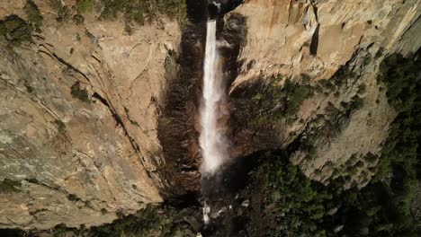 a wide angle, drone, aerial, and cinematic shots of the bridalveil waterfalls in yosemite national park