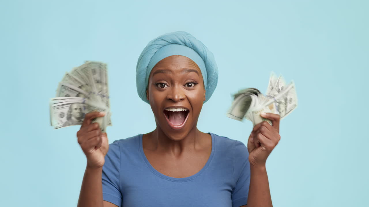 Excited Woman Celebrating with Money