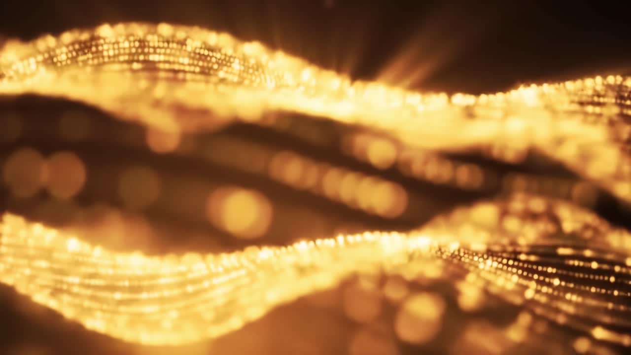 Explore the enchanting movement of golden waves that create a stunning visual effect. This captivating display showcases fluidity and light, making for a mesmerizing spectacle.