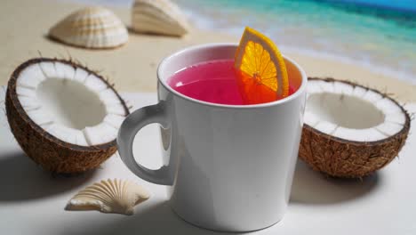 pink tropical drink with coconuts and seashells