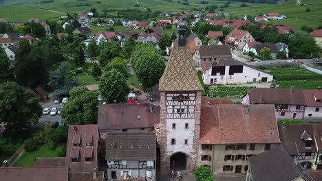 a stationary aerial footage of the whole village while facing the clock tower