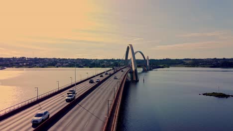 traffic over jk bridge in brasilia on sunset, aerial view