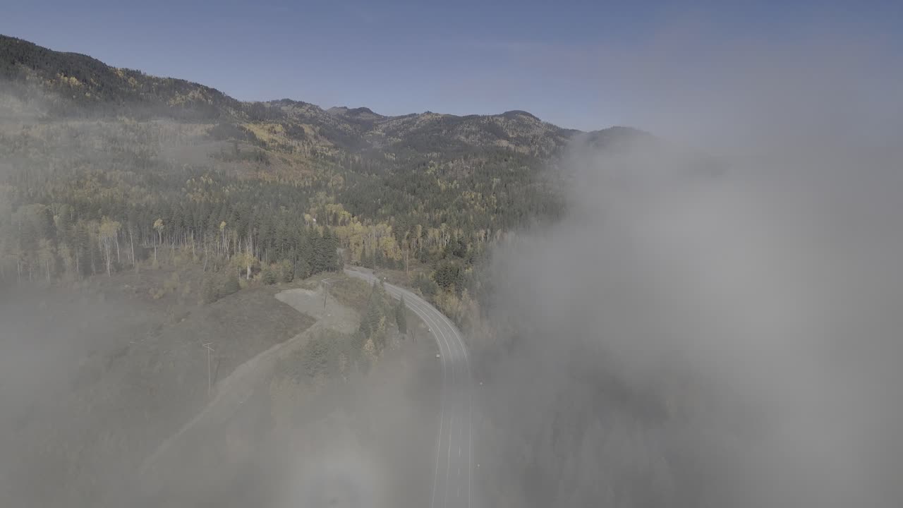 Veiled Tranquility: Bird's Eye Glimpse of Fog-Covered Highway 24 in Autumn