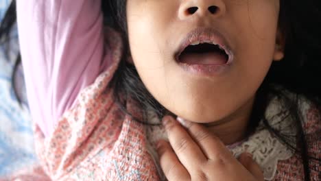 close up portrait of a young girl with her mouth open