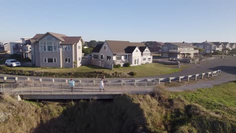 4K-aerial-drone-shot-overlooking-bridge-in-Bandon,-Oregon