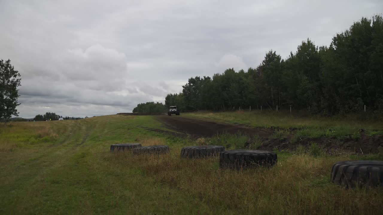 Video following an all terrain vehicle going up the hill