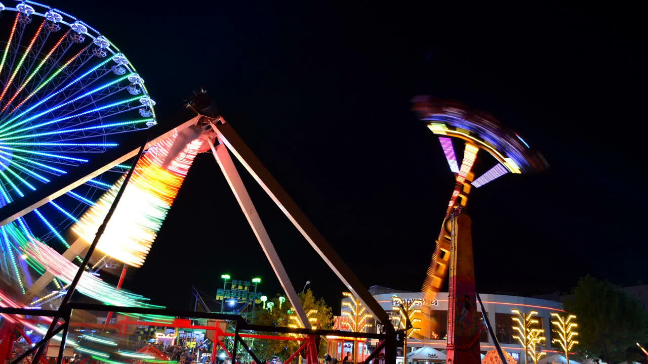 Attraction pendulum. Time lapse. Night attraction