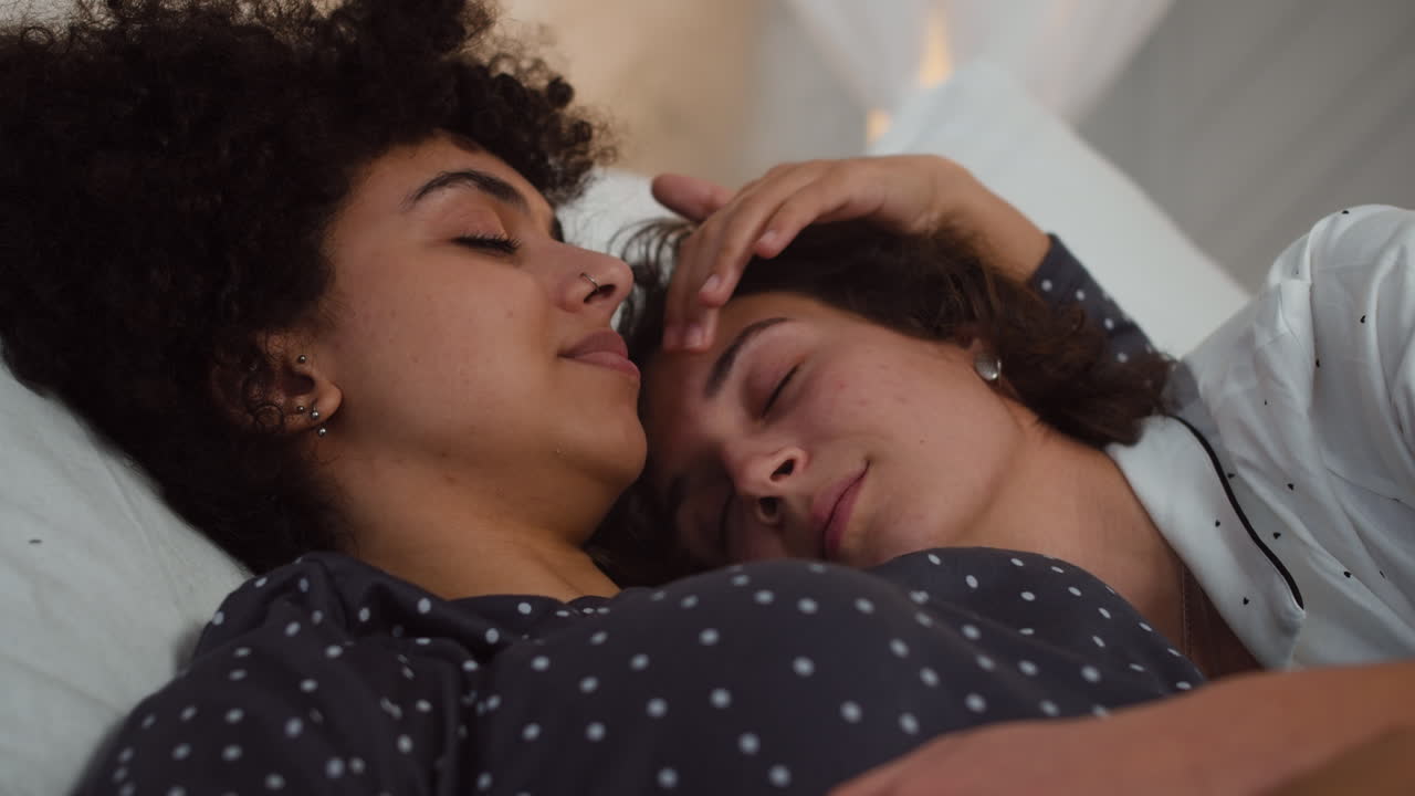 Happy couple laying on bed