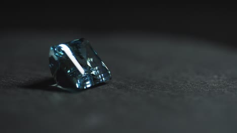 polished blue gemstone rotates and sparkles