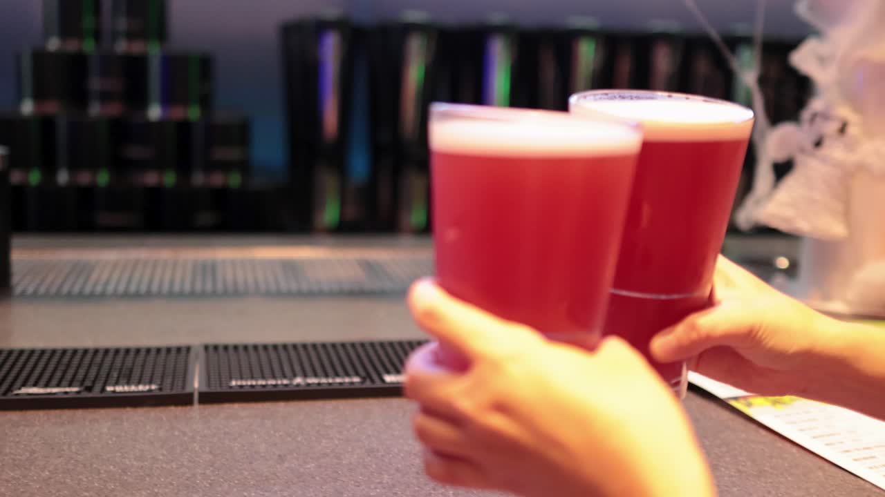 Friends enjoying drinks at a lively bar