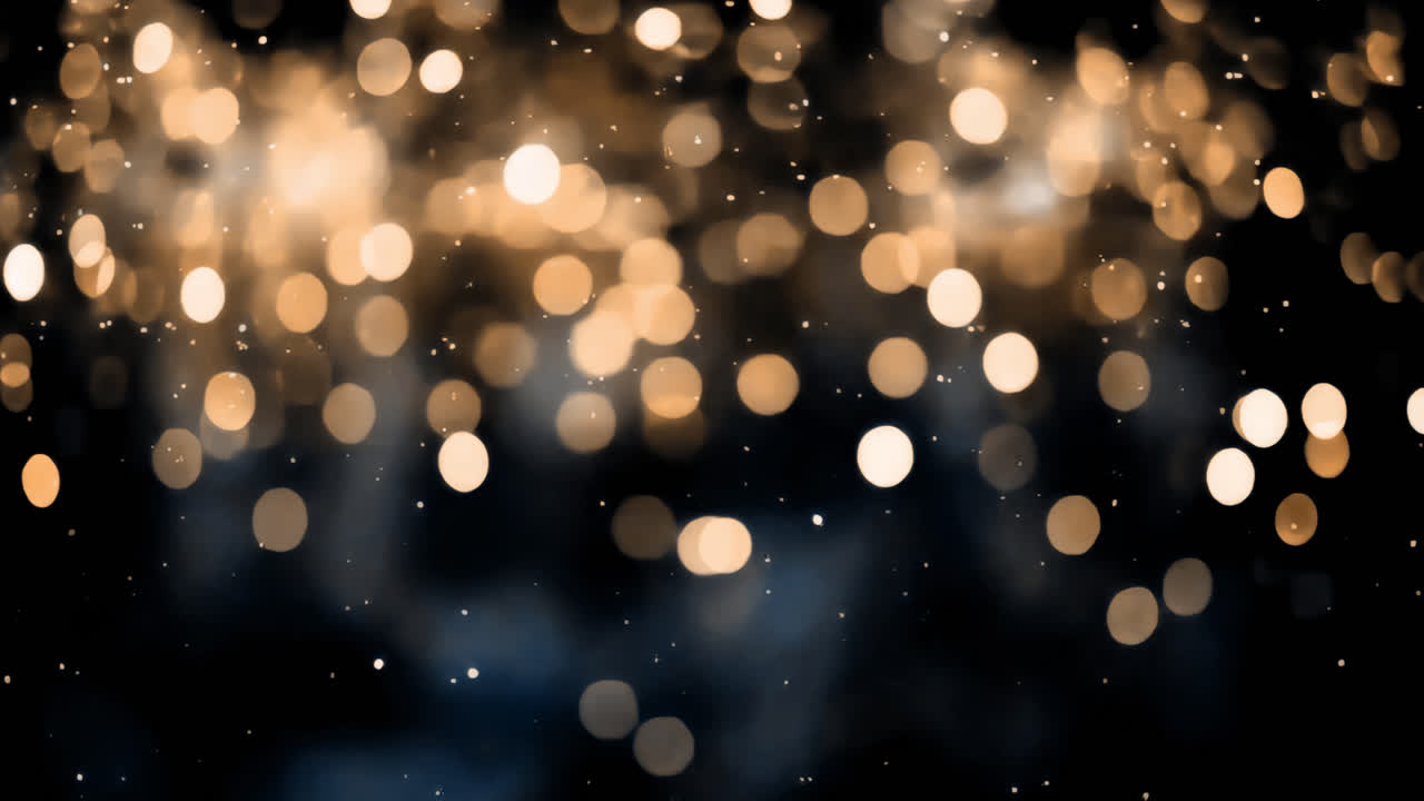 Warm golden bokeh lights against a dark background, creating a cozy glow animated overlay