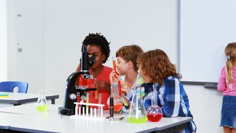Kids-doing-a-chemical-experiment-in-laboratory