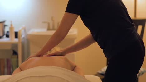 woman getting a back massage at the spa