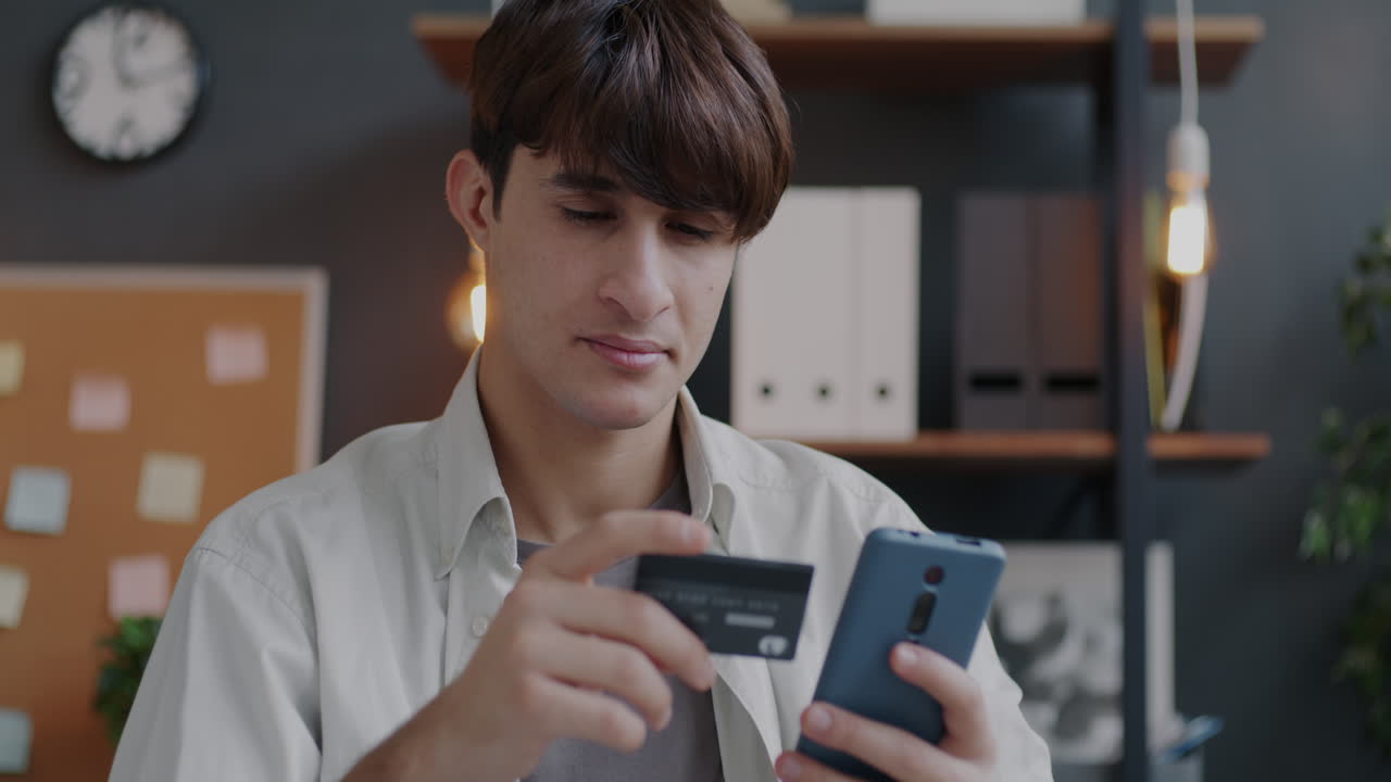 Man making mobile payment with credit card